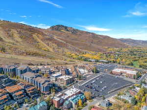 Birds eye view of property with a mountain view