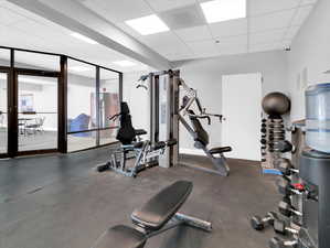 Exercise room featuring a drop ceiling