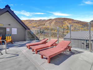 View of patio / terrace featuring a mountain view and an outdoor structure