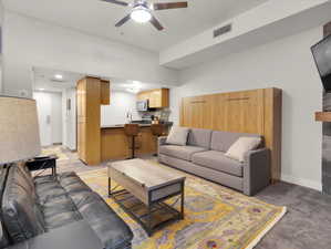 Living room featuring ceiling fan