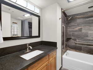 Bathroom featuring vanity and shower / bath combo