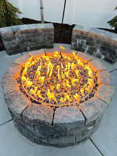 Exterior details featuring a fire pit and concrete floors