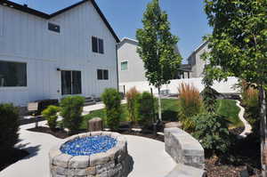 View of patio with a fire pit