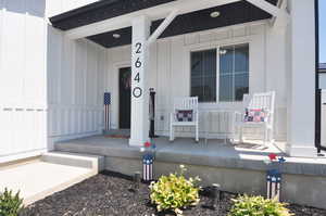 Entrance to property with a porch