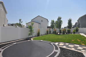 View of yard with trampoline