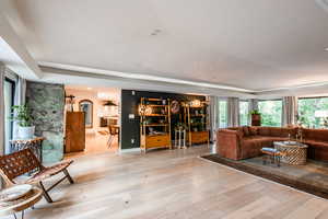 Living room featuring open concept and large window walls