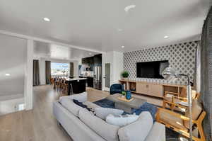 Living room with light hardwood / wood-style floors