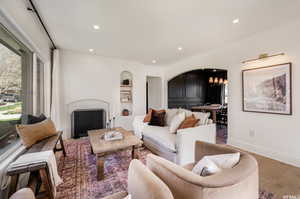 Living room with hardwood / wood-style flooring