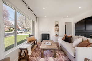 Living room featuring plenty of natural light and hardwood / wood-style floors