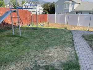 View of yard featuring a playground