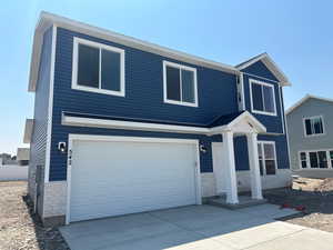 View of front of home with a garage