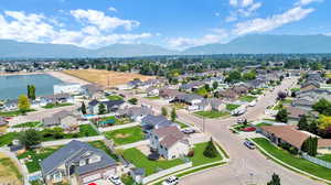 Drone / aerial view with a water and mountain view