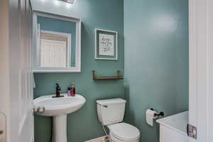 Half Bath with Pedestal Sink, Updated Black Faucet, Mirror, Lighting & Bathroom Accessories