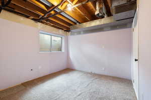 Basement half finished bedroom with shared ensuite bathroom. New carpet recently installed.