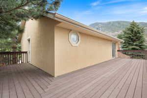 Wooden Trex deck featuring both mountain and valley views. Deck connects Primary Bedroom to first bedroom on second floor.