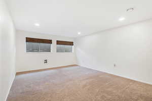 View of carpeted spare bedroom with shared ensuite bathroom.