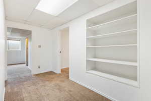 Interior space featuring in-wall storage shelving