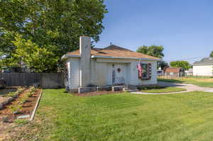 Exterior space featuring a lawn