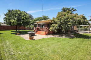 View of yard with a wooden deck