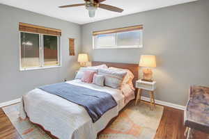 Bedroom featuring wood-type flooring and ceiling fan