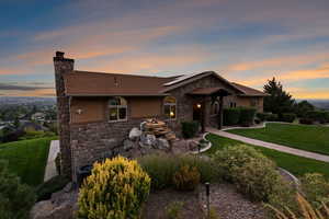 View of front of home featuring a lawn