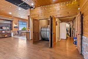 Interior space with wooden walls, wood-type flooring, and wood ceiling