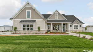 Craftsman house featuring a front lawn