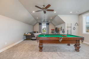 Rec room featuring light colored carpet, ceiling fan, lofted ceiling, and pool table