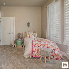 Bedroom with carpet flooring