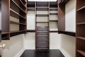 Walk in closet featuring wood-type flooring