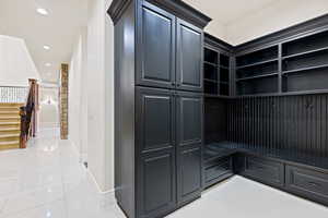 Mudroom featuring light tile patterned floors