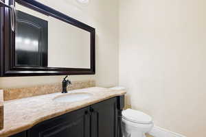 Bathroom with vanity and toilet