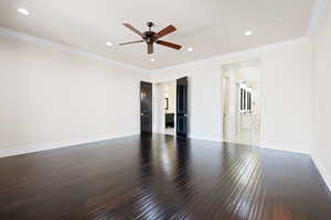 Master Bedroom with hardwood / wood-style flooring, ornamental molding, and ceiling fan