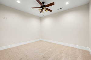 Spare room with carpet flooring and ceiling fan