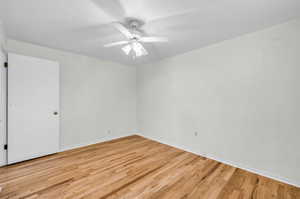 Unfurnished room with light hardwood / wood-style flooring and ceiling fan