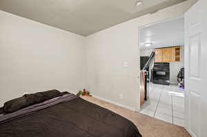 Bedroom with light tile patterned floors