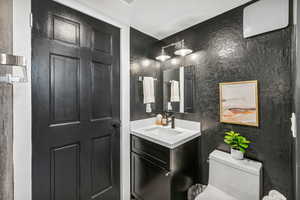 Bathroom with vanity and toilet