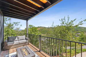 Balcony with an outdoor living space with a fire pit