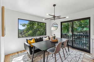 Dining space featuring light hardwood / wood-style floors and an inviting chandelier