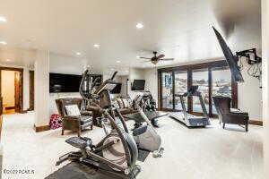 Workout room featuring ceiling fan