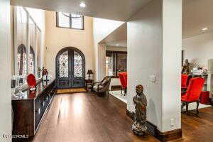 Foyer featuring dark wood-type flooring and french doors