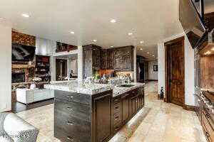 Kitchen with a kitchen island and dark brown cabinets