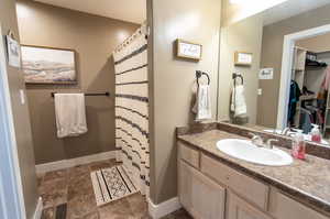 Bathroom featuring vanity and tile patterned floors