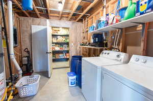 Washroom with washing machine and clothes dryer