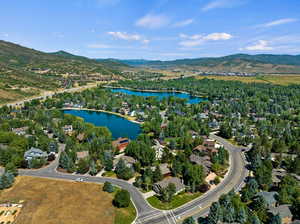 Aerial view featuring a water and mountain view