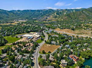 Birds eye view of property with a mountain view