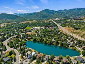 Bird's eye view featuring a water and mountain view