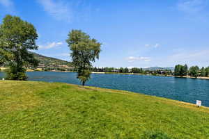 View of water feature with a mountain view