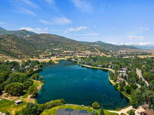 Bird's eye view with a water and mountain view