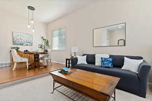 Living room with light hardwood / wood-style floors